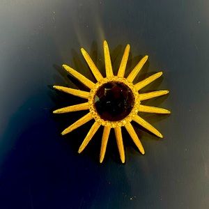 VINTAGE starburst broach with crystals and center blue stone!